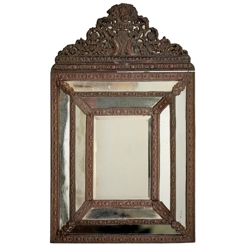 560 - A Northern European embossed sheet brass covered mirror, c1900, with margin mirror surround, 83cm h... 