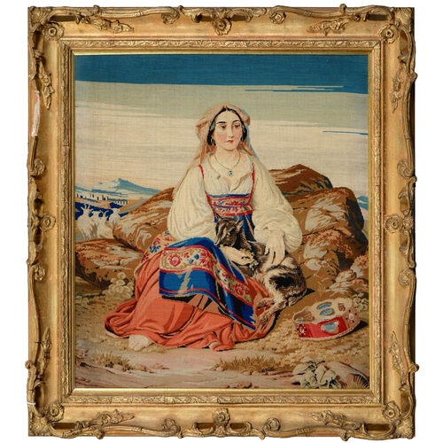 561 - A Victorian Berlin woolwork picture of a Circassian woman seated in a landscape, 60 x 53.5cm... 