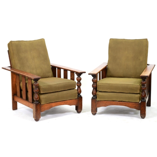 852 - A pair of substantial oak armchairs with reclining backs, 1930's, contemporary cushions, arms 91cm l... 