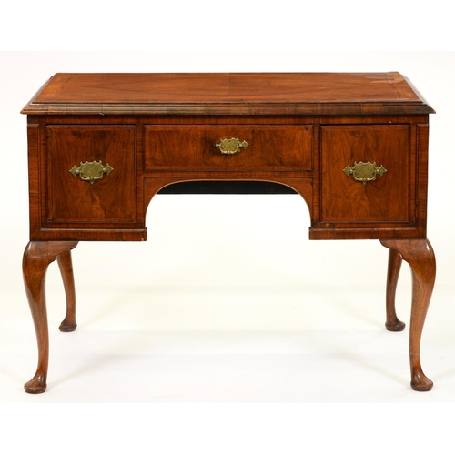 868 - A walnut and feather banded low boy, late 19th c, the quarter veneered top with ovolo lip and fitted... 