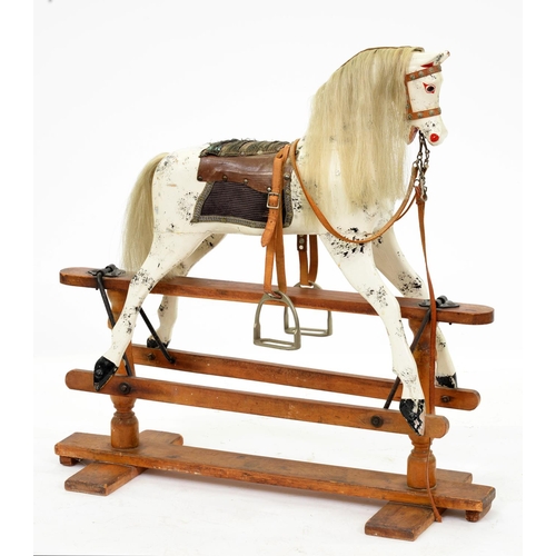 922 - An English painted wood rocking horse, on pine stand, second quarter 20th c, with horse hair mane an... 