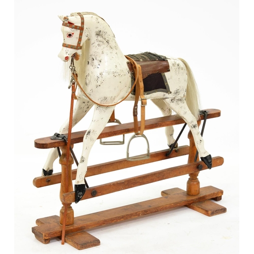 922 - An English painted wood rocking horse, on pine stand, second quarter 20th c, with horse hair mane an... 