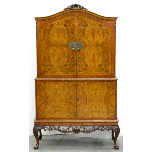 925 - A walnut and burr walnut cocktail cabinet, mid 20th c, with ornate pierced brass escutcheons, 172cm ... 