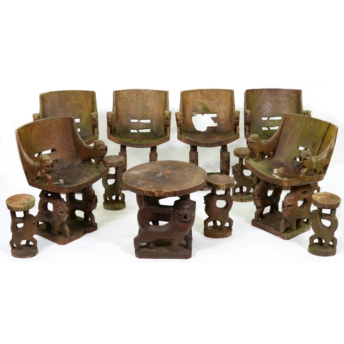 951 - Tribal art. An unusual and distinctive suite of carved, dug-out hardwood garden furniture, second ha... 