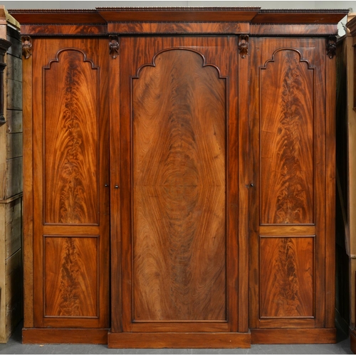 958 - A Victorian breakfront flame figured mahogany wardrobe, 213cm h; 68 x 210cm