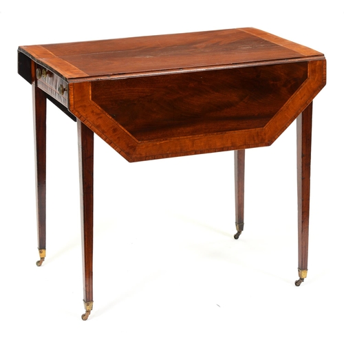 965 - A Victorian mahogany and satinwood Pembroke table, the figured top with cut cornered leaves, fitted ... 