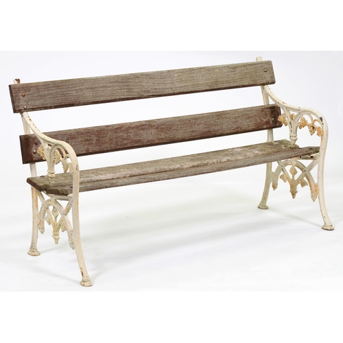 978 - A garden seat, with pair of Victorian cast iron ends and later wood slats, 153cm l