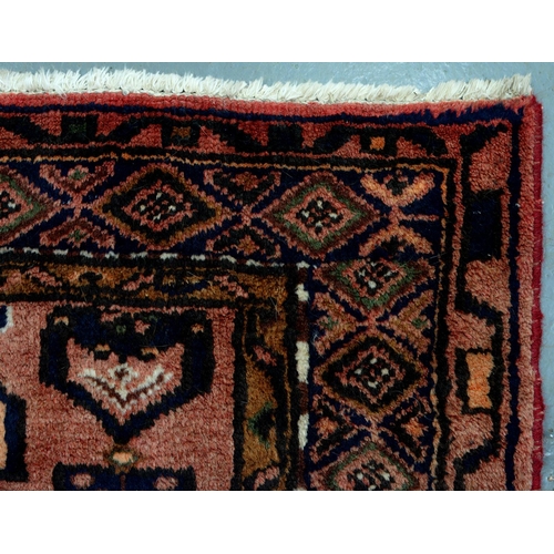 986 - A rug, 126 x 206cm