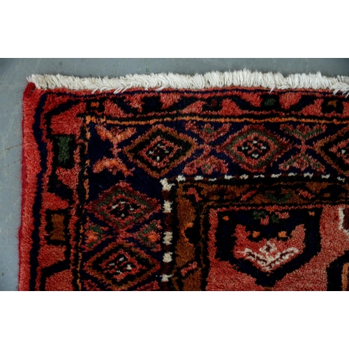 986 - A rug, 126 x 206cm