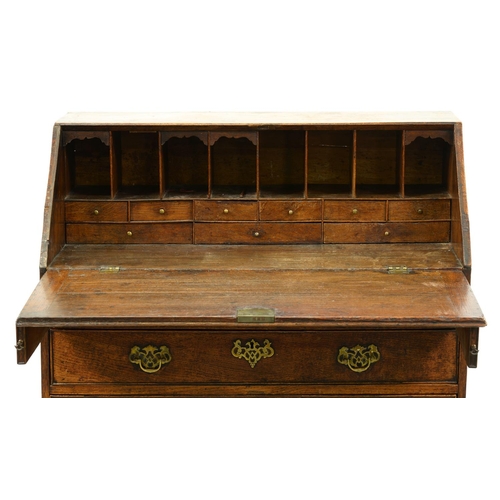 990 - A George III oak bureau, with fitted interior on bracket feet, 101cm h; 50 x 90cm