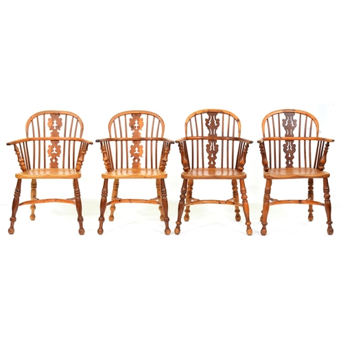 991 - A set of four yew wood low back Windsor chairs, 20th c, in Victorian style with fretted 'fir tree' s... 