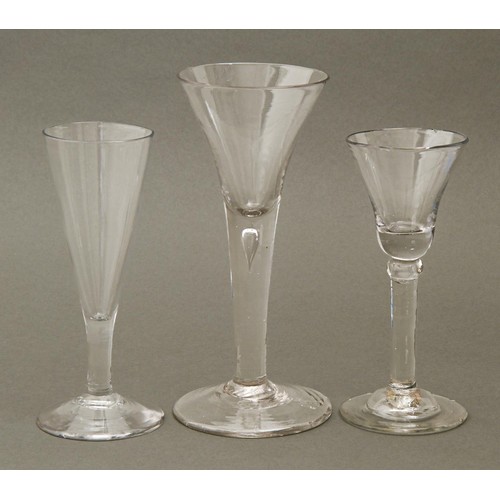 233 - Three George III wine glasses, two with bell or trumpet bowl on teared or knopped straight stem, 19c... 