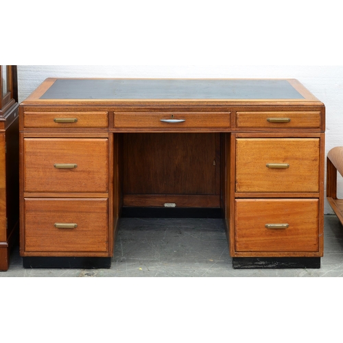 1214 - A mahogany pedestal desk, with panelled sides, 75cm x 131cm, maker's trade label of H Baldock & ... 