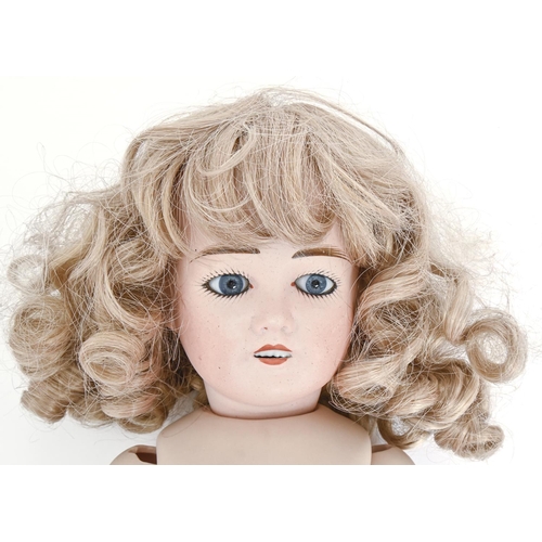 1025 - A Limoges bisque character doll's head, early 20th c, with glass paperweight eyes, painted eyelashes... 