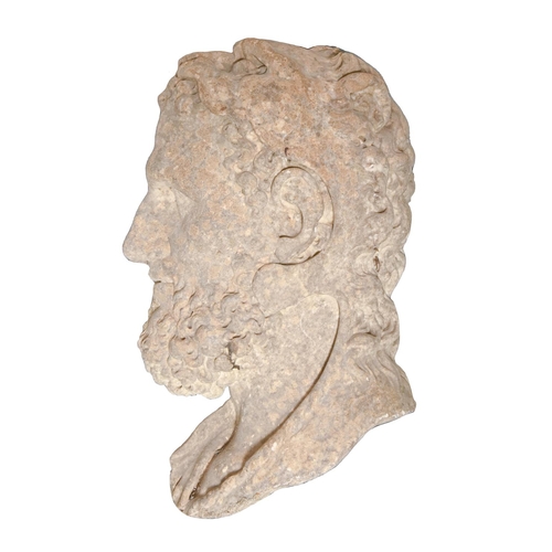 1044 - A Grand Tour statuary marble relief of the head of Hercules, 19th c, 47cm h