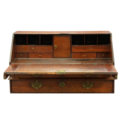 1194 - A George III oak bureau, with fitted interior, 104cm h; 54 x 96cm