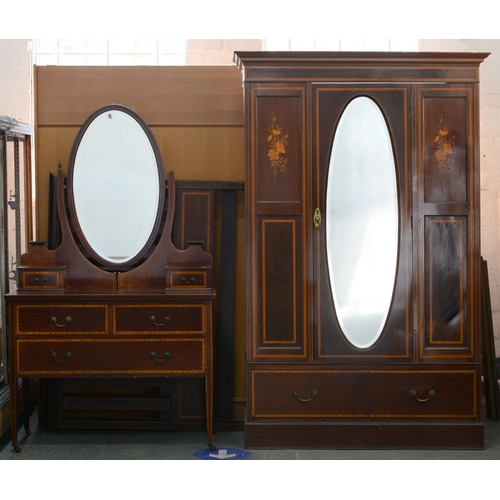 1220 - An Edwardian mahogany and inlaid bedroom suite, comprising wardrobe, dressing table with oval swing ... 