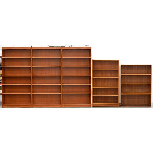 1228 - A set of three teak stained open bookcases, 1970's, with adjustable shelves, 180cm h; 28 x 89cm and ... 