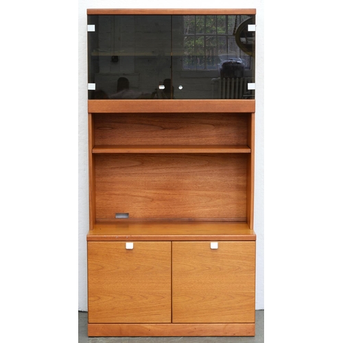 1231 - A teak wall unit, c. 1970, glazed cabinet above a shelf and a niche, cupboard base, 178cm h; 47 x 92... 