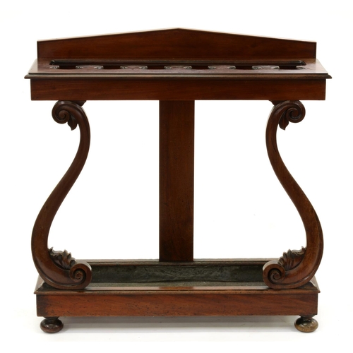 1237 - A Victorian mahogany umbrella stand, the top with shaped divisions on carved S-shaped supports and r... 