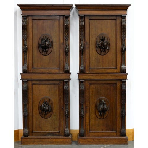 1244 - A pair of Victorian oak cabinets, the upper and lower panelled door applied with almost full relief ... 