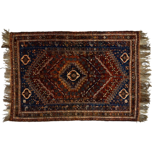 1250 - A Persian style rug, 20th c, blue ground with geometric motifs in earthy tones, 240 x 170cm... 