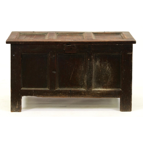 1253 - A Charles II oak chest, with three panel lid and front, on stiles, 56cm h; 50 x 101cm and a metal li... 