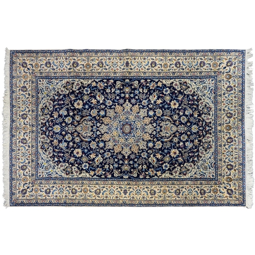 1266 - A Kashan medallion rug, mid 20th c, with indigo field, 136 x 221cm