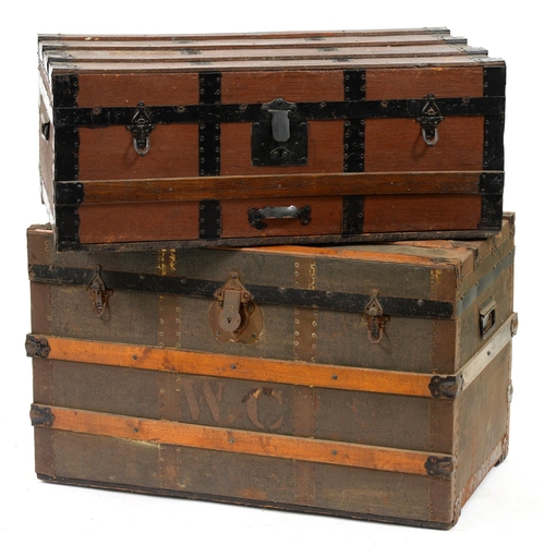 1278 - Two travelling or cabin trunks, early 20th c, of fabric covered wood with varnished or stained wood ... 