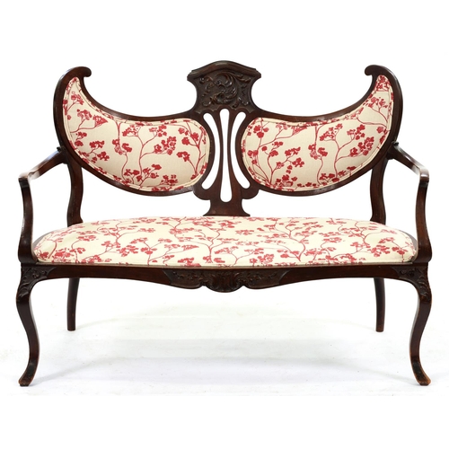 1282 - An Edwardian carved mahogany twin chair back settee, on cabriole legs