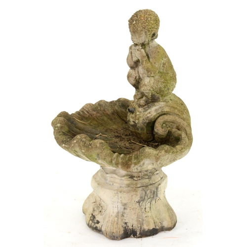 1289 - A concrete garden fountain, in the form of a faun on a shell, 75cm h