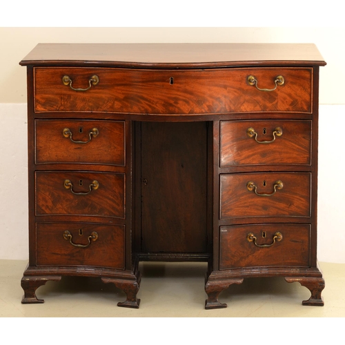 1308 - A George III serpentine mahogany dressing chest, with seven moulded drawers, on ogee feet, 83cm h; 5... 