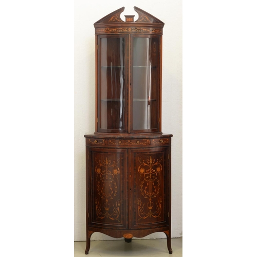 1311 - An Edwardian bow fronted mahogany, calamander and marquetry corner cabinet, with open triangular ped... 