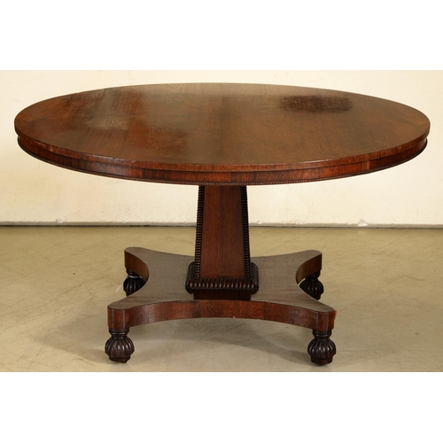 1312 - A William IV rosewood breakfast table, the figured top on square tapered pillar, quadripartite base ... 