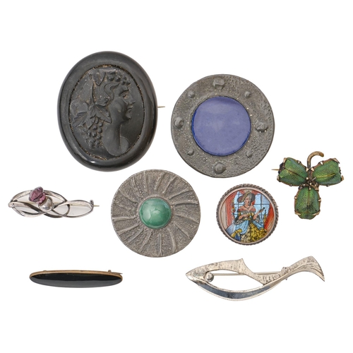 206 - Two Arts and Crafts pewter coloured aluminium brooches, each set with a Ruskin type pottery cabochon... 