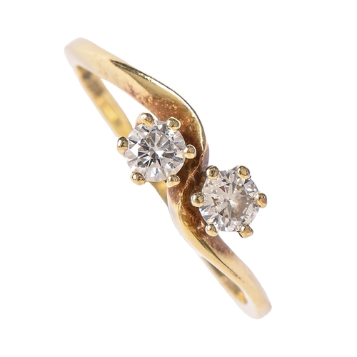 21 - A diamond crossover ring, in 18ct gold, 2.2g, size K