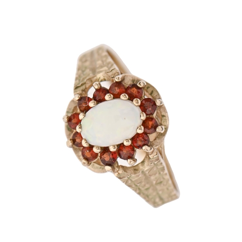 224 - An opal and garnet cluster ring, in 9ct gold, London 1979, 2.7g, size O