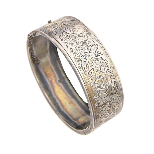 250 - A Victorian silver bangle, foliate engraved, 53mm (internal), Chester 1885, 15dwts