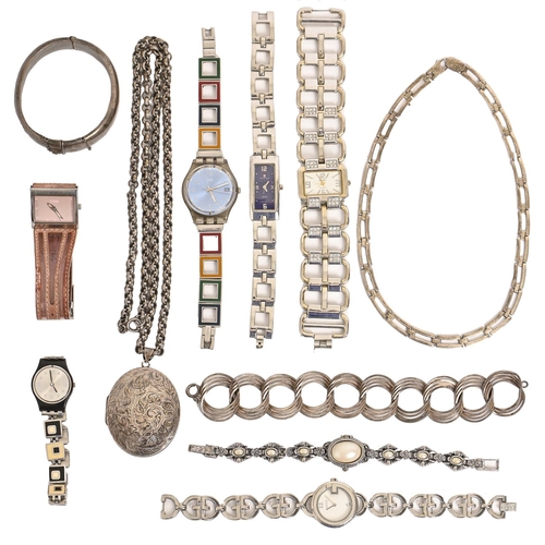 312 - A silver locket and other articles, and several modern fashion wristwatches