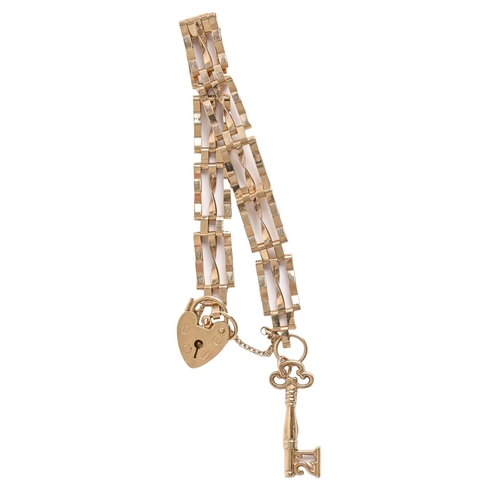 56 - A 9ct gold gate bracelet, padlock and key charm, bracelet 14cm l, 9g