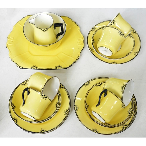 587 - A Beswick & Son yellow ground bone china tea service, c1925-1930, moulded plate 25.5cm over hand... 