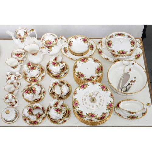 599 - A Royal Albert Old Country Roses pattern dinner service and a wall clock, printed mark... 