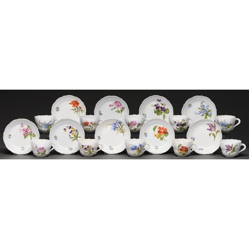 606 - A set of ten Meissen coffee cups and eleven saucers, 20th c, painted with flowers, saucer 10.5cm dia... 