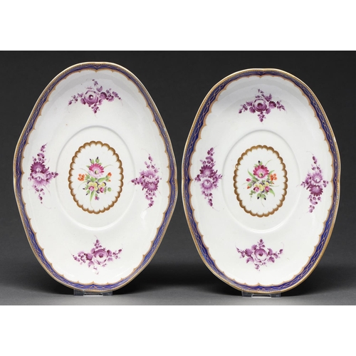 609 - A pair of Worcester oval dessert tureen stands, c1780, painted in polychrome and purple monochrome w... 