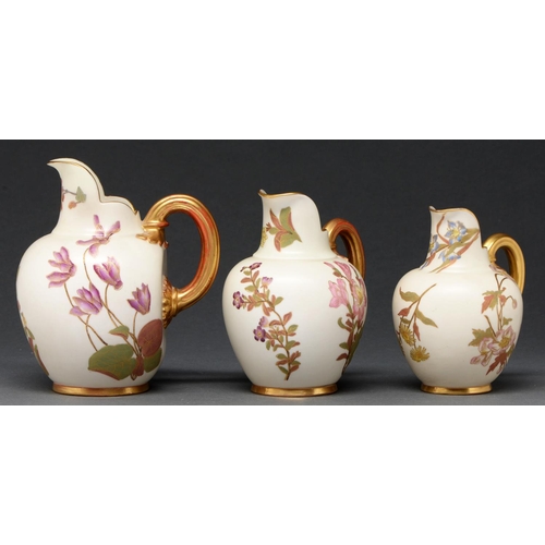 631 - Three Royal Worcester jugs, 1889 and 1892, printed and painted with naturalistic flowers on an ivory... 