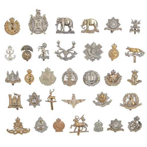 797 - An extensive collection of British army metal cap badges, including many regiments and corps, an ARP... 