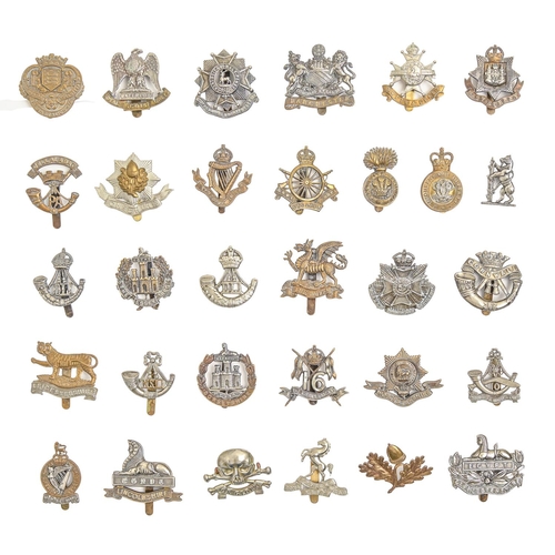 797 - An extensive collection of British army metal cap badges, including many regiments and corps, an ARP... 