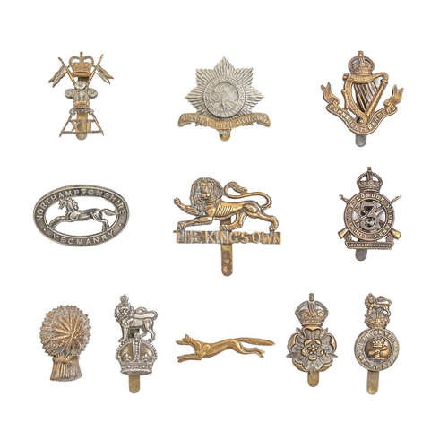 797 - An extensive collection of British army metal cap badges, including many regiments and corps, an ARP... 