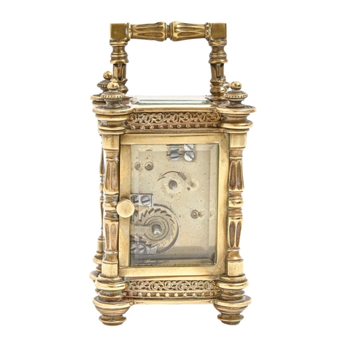 823 - A French miniature brass carriage timepiece, Arnold and Lewis Manchester & Paris, c1900, with en... 