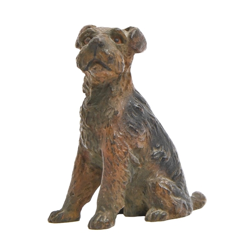 835 - A miniature cold painted bronze sculpture of a seated terrier, 20th c, 45mm h